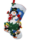 The Perfect Tree finished Bucilla felt Christmas stocking with a snowman and penguins with a Christmas tree, front view
