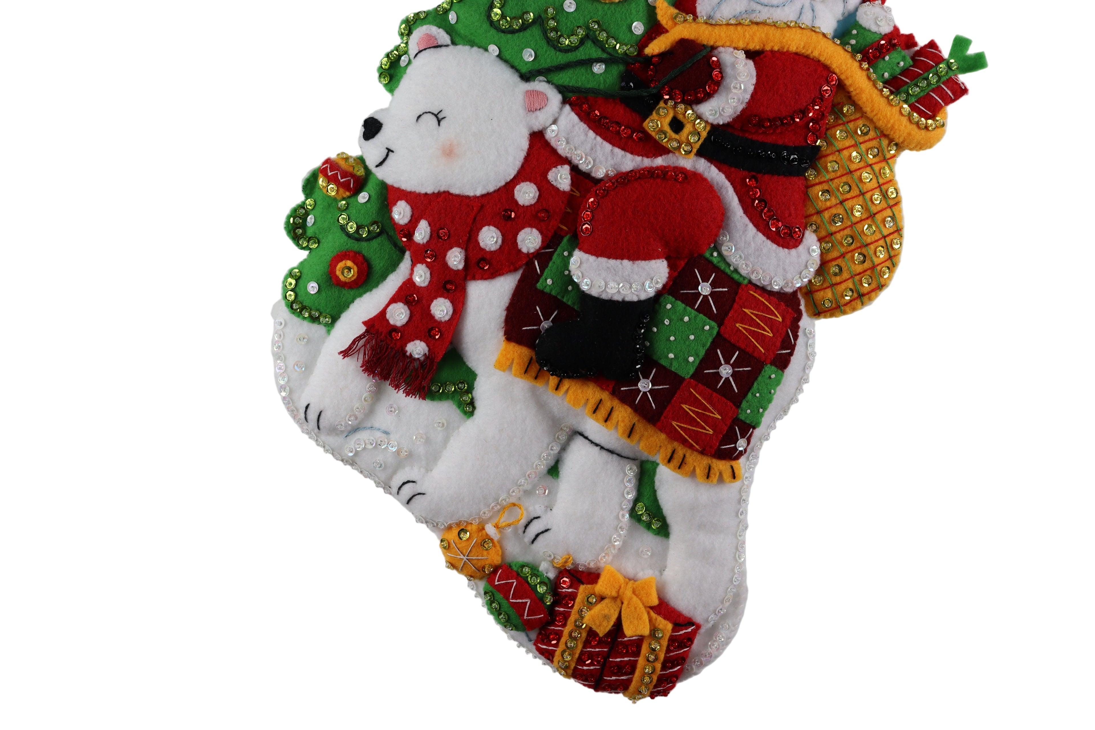 Decorative Christmas ornament with a polar bear, presents, and festive decorations on a white background.