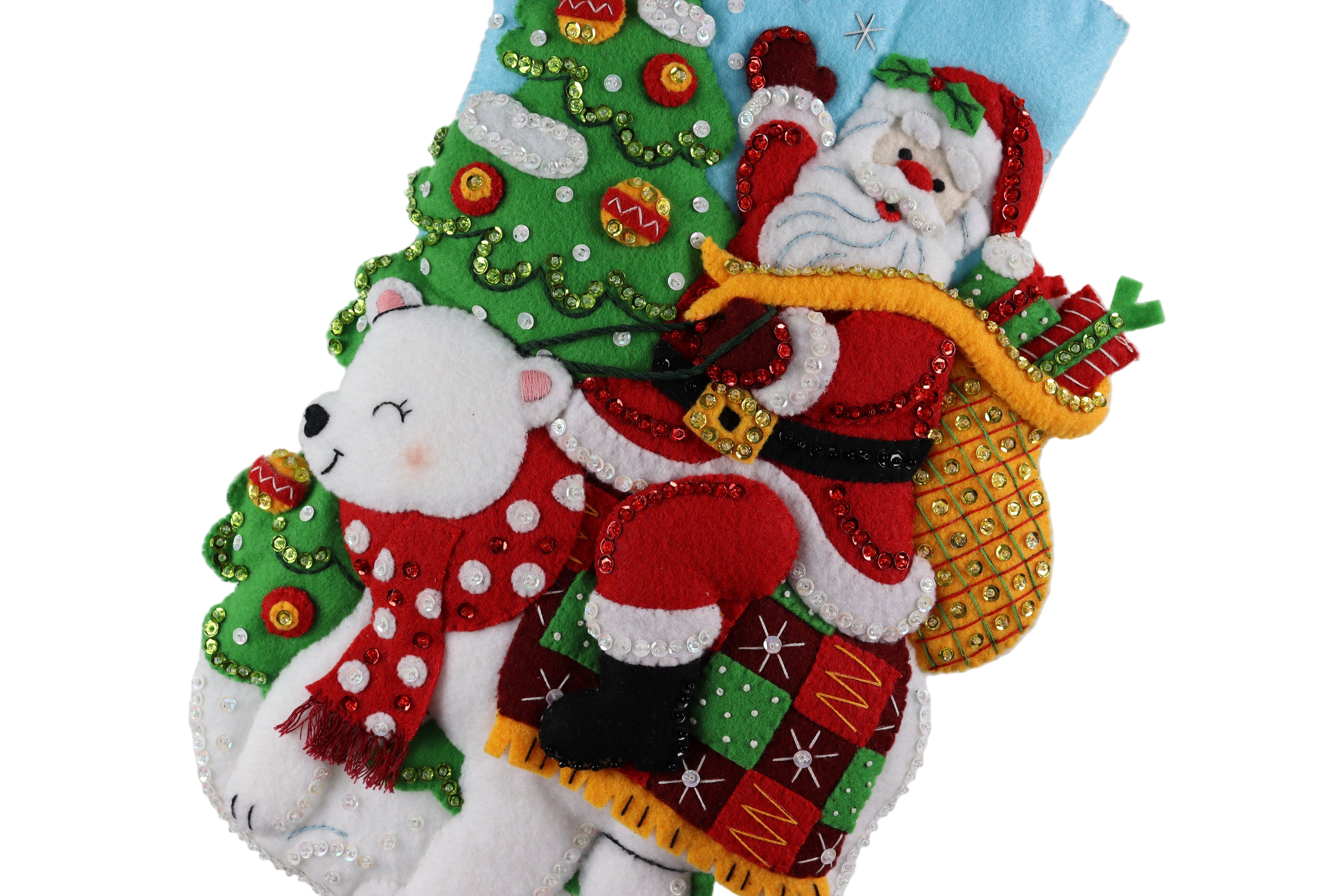 Decorative Christmas stocking with Santa Claus, polar bear, and Christmas tree design on a white background.