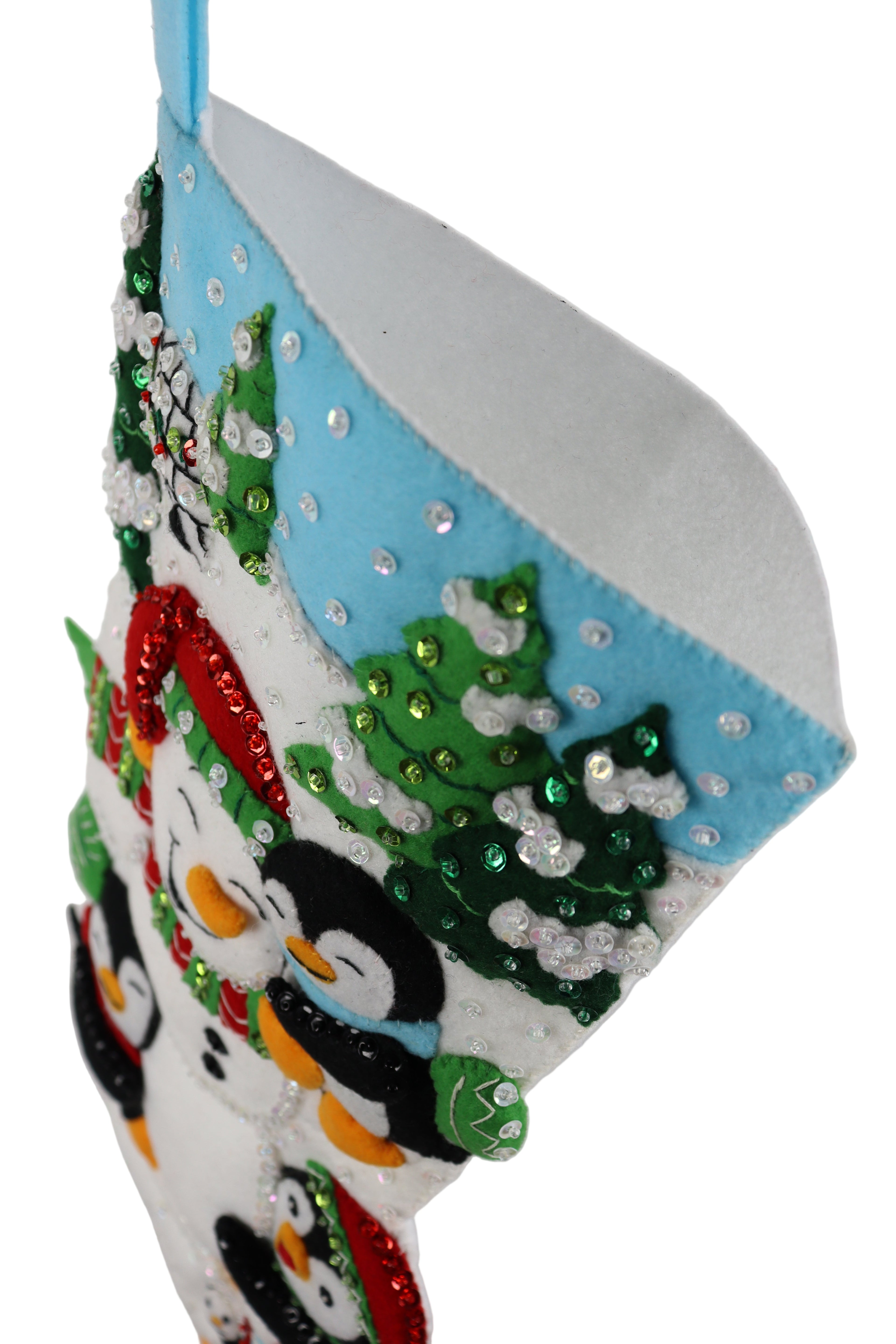 Decorative headband with penguins and a Christmas tree design on a white background