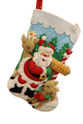 Finished North Pole Santa Bucilla felt Christmas stocking: Santa hugging the North Pole sign with two reindeer, a cardinal and snowy pine trees
