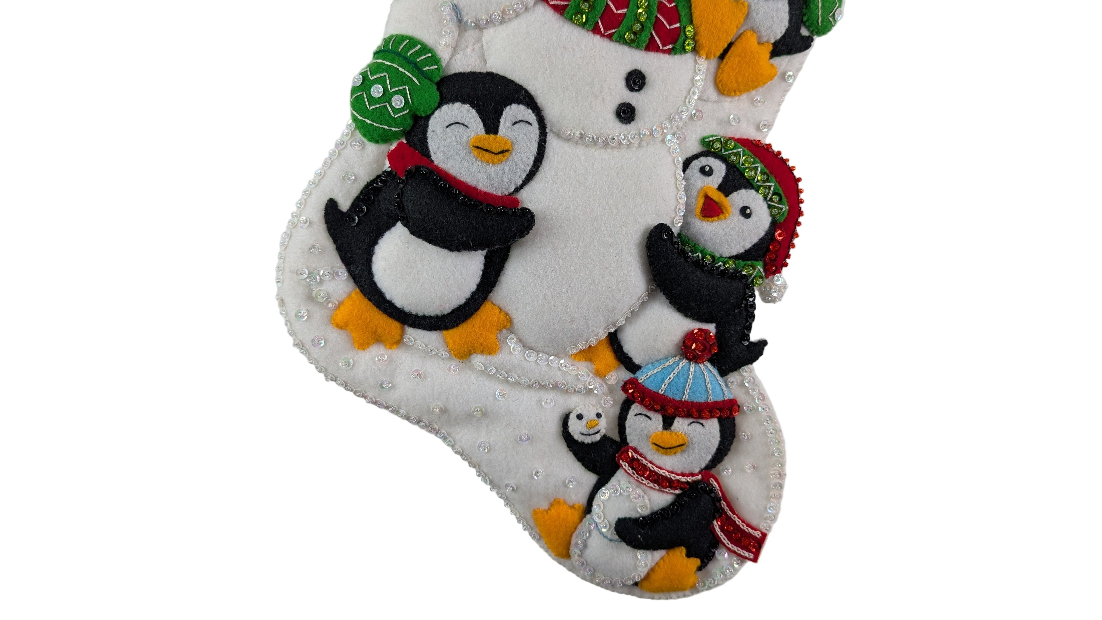 Decorative Christmas stocking with penguins and a snowman on a white background